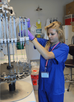 Stanford University student adjusting N-EVAP evaporator needles