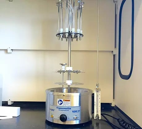 Organomation's 6 Position N-EVAP Nitrogen Evaporator in C-HAWQ lab's fume hood